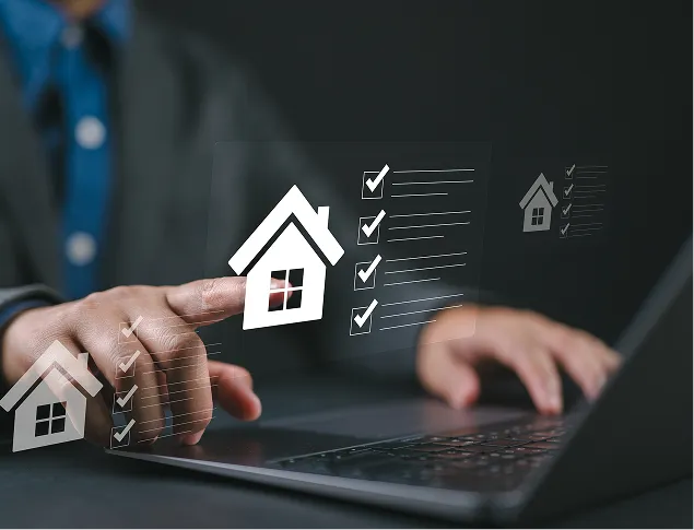 Person in business attire interacting with virtual house icons and checklists above a laptop keyboard.